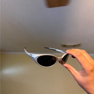 Oakley Silver Frame Black Lens Sunglasses